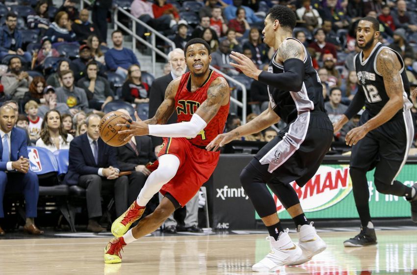 Jan 1, 2017; Atlanta, GA, USA; Atlanta Hawks forward Kent Bazemore (24) drives to the basket against the San Antonio Spurs in the first quarter at Philips Arena. Mandatory Credit: Brett Davis-USA TODAY Sports 