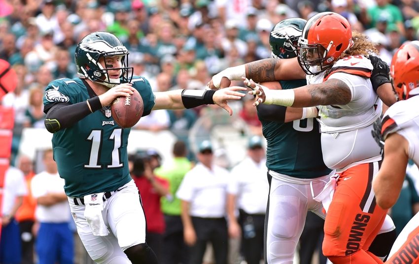 Sep 11, 2016; Philadelphia, PA, USA; Philadelphia Eagles quarterback Carson Wentz (11) under pressure from Cleveland Browns defensive lineman <a rel=