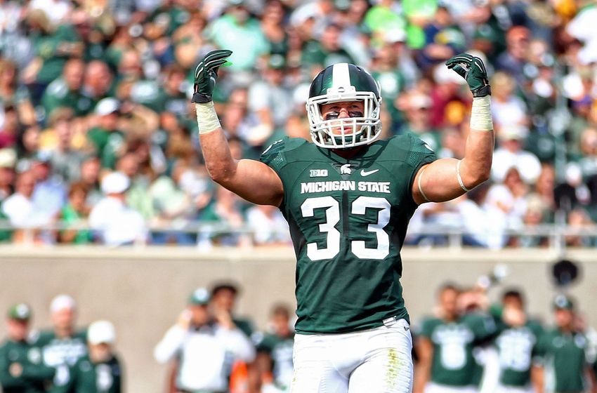 Sep 26, 2015; East Lansing, MI, USA; Michigan State Spartans linebacker Jon Reschke (33) gestures to student section during the 1st half of a game against Central Michigan at Spartan Stadium. Mandatory Credit: Mike Carter-USA TODAY Sports