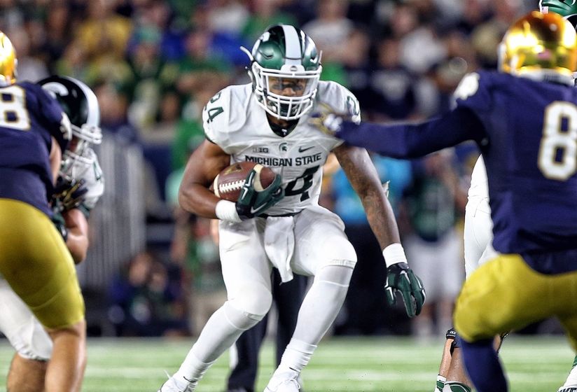 Sep 17, 2016; South Bend, IN, USA; Michigan State Spartans running back Gerald Holmes (24) runs the ball against the Notre Dame Fighting Irish during the second half a game at Notre Dame Stadium. Mandatory Credit: Mike Carter-USA TODAY Sports