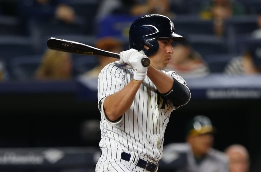 Apr 21, 2016; Bronx, NY, USA; New York Yankees center fielder Jacoby Ellsbury (22) hits a single in the seventh inning against the Oakland Athletics at Yankee Stadium. Mandatory Credit: Noah K. Murray-USA TODAY Sports