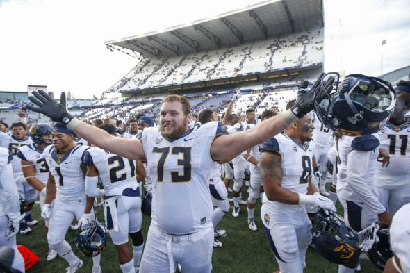 Sep 26, 2015; Seattle, WA, USA; California Golden Bears offensive lineman Jordan Rigsbee (73) celebrates the 30-24 win over the Washington Huskies at Husky Stadium. Mandatory Credit: Jennifer Buchanan-USA TODAY Sports