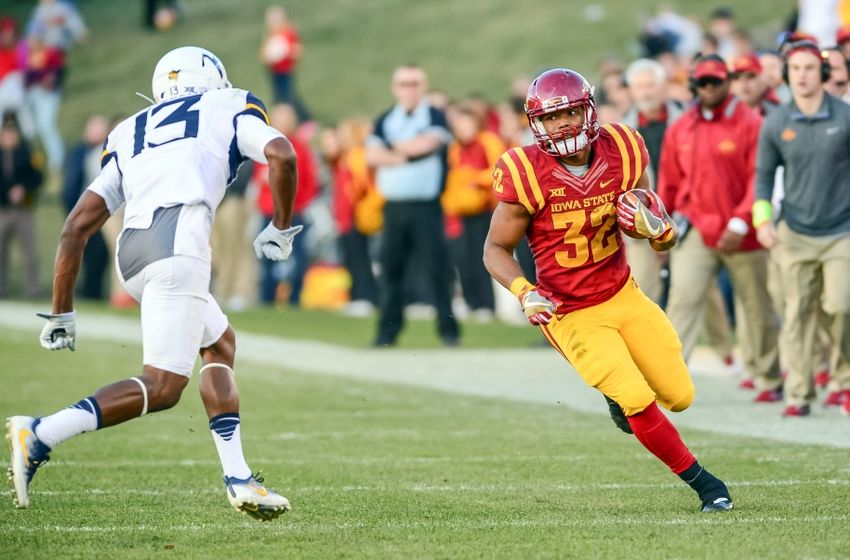 Nov 26, 2016; Ames, IA, USA; Iowa State Cyclones running back David Montgomery (32) runs the ball as West Virginia Mountaineers cornerback Rasul Douglas (13) defends during the second quarter at Jack Trice Stadium. Mandatory Credit: Jeffrey Becker-USA TODAY Sports