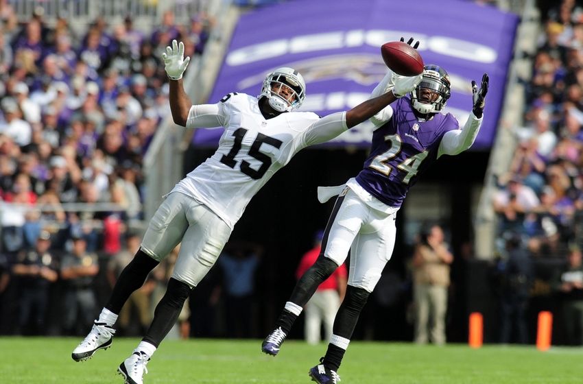 Oct 2, 2016; Baltimore, MD, USA; Oakland Raiders wide receiver Michael Crabtree (15) cannot catch a pass while being defended by Baltimore Ravens cornerback Shareece Wright (24) in the third quarter at M&T Bank Stadium. Mandatory Credit: Evan Habeeb-USA TODAY Sports