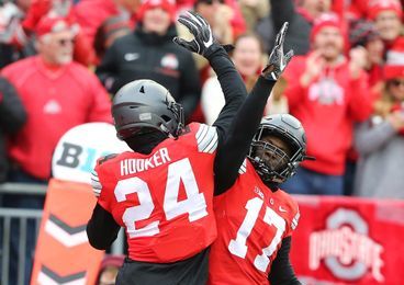 Nov 26, 2016; Columbus, OH, USA; Ohio State Buckeyes safety Malik Hooker (24) is congratulated by teammate Jerome Baker (17) following his pick six during the second quarter at Ohio Stadium. Michigan Wolverines lead at half 10-7. Mandatory Credit: Joe Maiorana-USA TODAY Sports