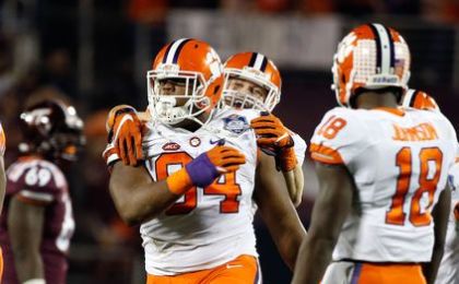 Dec 3, 2016; Orlando, FL, USA; Clemson Tigers defensive tackle Carlos Watkins (94) is congratulated by linebacker Ben Boulware (10) after he made a sack against the Virginia Tech Hokies during the second half of the ACC Championship college football game at Camping World Stadium. Clemson Tigers defeated the Virginia Tech Hokies 42-35. Mandatory Credit: Kim Klement-USA TODAY Sports