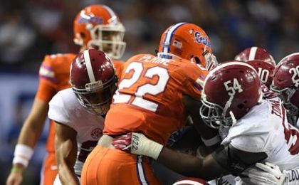 Dec 3, 2016; Atlanta, GA, USA; Florida Gators running back Lamical Perine (22) is brought down by Alabama Crimson Tide defense during the second quarter of the SEC Championship college football game at Georgia Dome. Mandatory Credit: John David Mercer-USA TODAY Sports