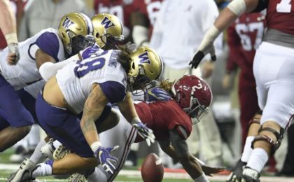 Dec 31, 2016; Atlanta, GA, USA; Alabama Crimson Tide quarterback Jalen Hurts (2) fumbles the ball against Washington Huskies linebacker Psalm Wooching (28) during the third quarter in the 2016 CFP semifinal at the Peach Bowl at the Georgia Dome. Mandatory Credit: Dale Zanine-USA TODAY Sports