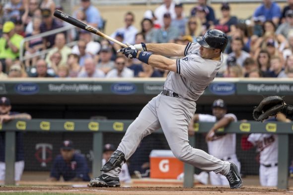 Jul 24, 2015; Minneapolis, MN, USA; New York Yankees first baseman Mark Teixeira (25) hits a single in the first inning against the Minnesota Twins at Target Field. Mandatory Credit: Jesse Johnson-USA TODAY Sports