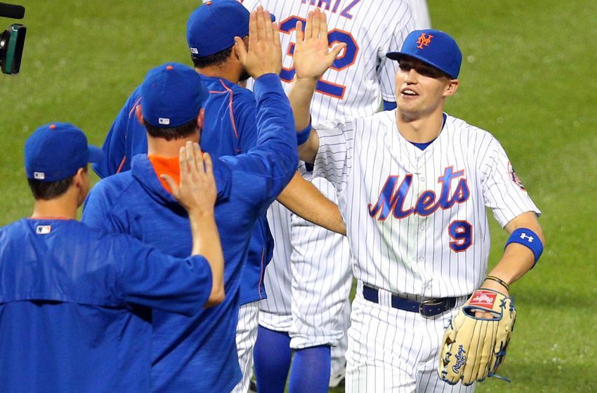 Jul 1, 2016; New York City, NY, USA; New York Mets right fielder Brandon Nimmo (9) celebrates after defeating the Chicago Cubs at Citi Field. The Mets defeated the Cubs 10-2. Mandatory Credit: Brad Penner-USA TODAY Sports