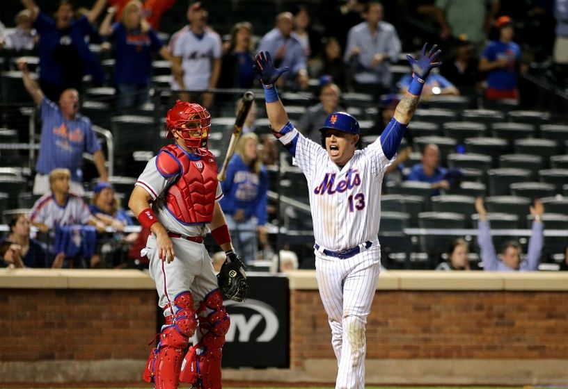 Philadelphia Phillies' Asdrubal Cabrera takes his place along the first  baseline with teammates after being announced before the Little League  Classic baseball game against the New York Mets at Bowman Field in