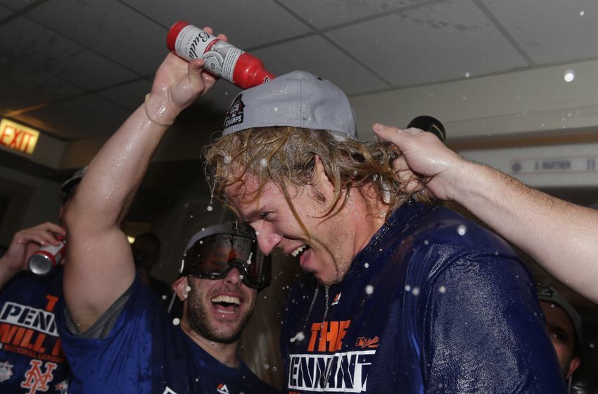 Oct 21, 2015; Chicago, IL, USA; New York Mets starting pitcher Noah Syndergaard celebrates with champagne in the clubhouse after defeating the Chicago Cubs in game four of the NLCS at Wrigley Field. The Mets advance to the World Series with a series sweep. Mandatory Credit: David J. Phllip/Pool Photo via USA TODAY Sports