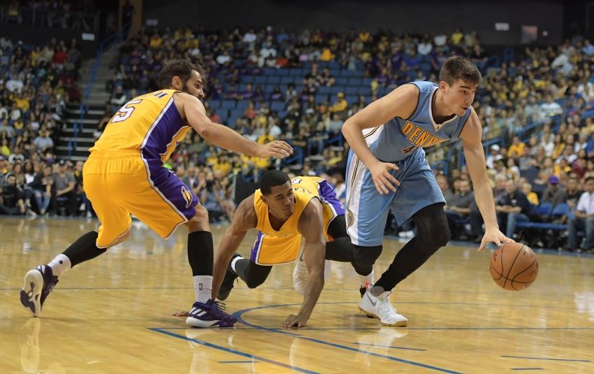 Oct 9, 2016; Ontario, CA, USA; Denver Nuggets forward Juancho Hernangomez (41) is defended by Los Angeles Lakers guard <a rel=