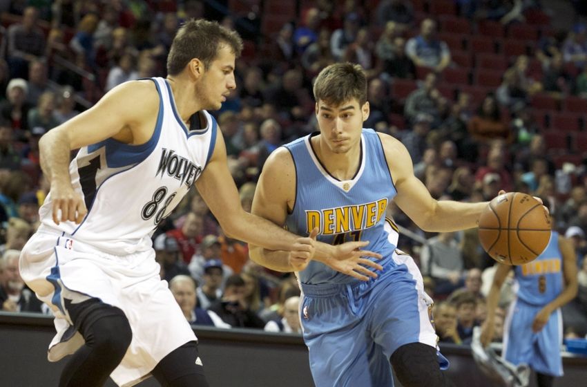 Oct 12, 2016; Lincoln, NE, USA; Denver Nuggets forward Juancho Hernangomez (41) drives against Minnesota Timberwolves forward <a rel=