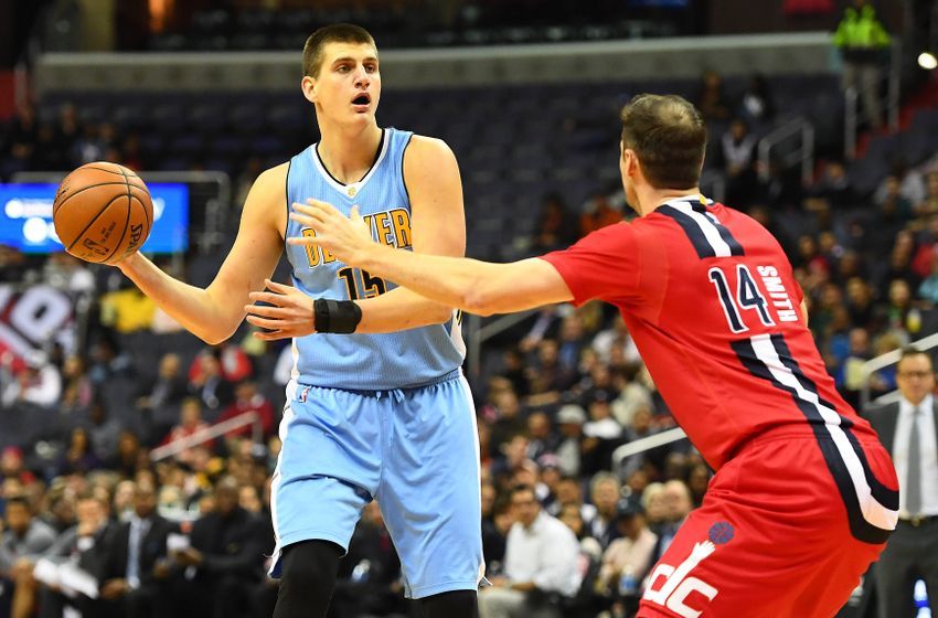 Dec 8, 2016; Washington, DC, USA; Denver Nuggets forward Nikola Jokic (15) looks to pass as Washington Wizards forward Jason Smith (14) defends during the first half at Verizon Center. Mandatory Credit: Brad Mills-USA TODAY Sports