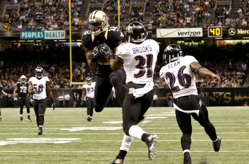 Nov 24, 2014; New Orleans, LA, USA; New Orleans Saints wide receiver Marques Colston (12) catches a 26 yard touchdown past Baltimore Ravens free safety Terrence Brooks (31) and strong safety Matt Elam (26) during the second quarter of a game at the Mercedes-Benz Superdome. Mandatory Credit: Derick E. Hingle-USA TODAY Sports