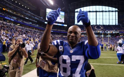 Jan 4, 2015; Indianapolis, IN, USA; Indianapolis Colts wide receiver Reggie Wayne (87) waves to the crowd after the 2014 AFC Wild Card playoff football game against the Cincinnati Bengals at Lucas Oil Stadium. Mandatory Credit: Brian Spurlock-USA TODAY Sports