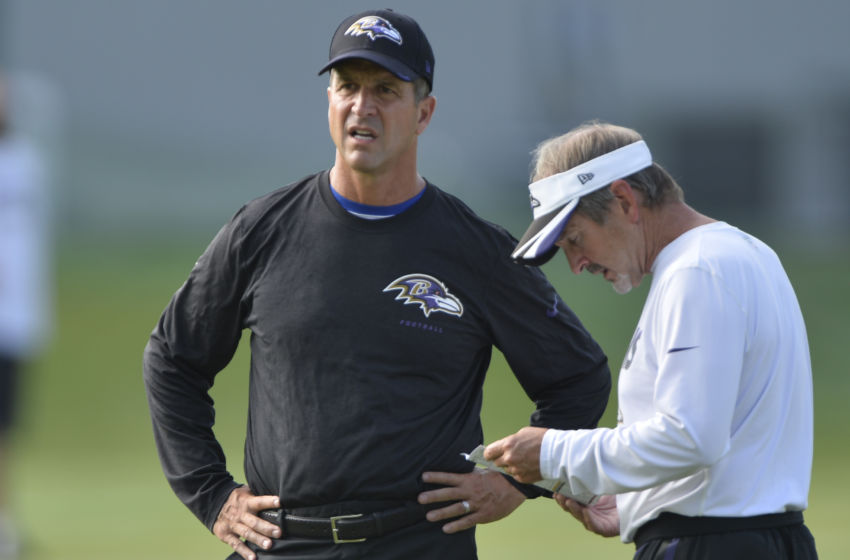 Jul 31, 2016; Owings Mills, MD, USA; Baltimore Ravens head coach John Harbaugh speaks with assistant coach Craig Versteeg during the morning session of training camp at Under Armour Performance Center. Mandatory Credit: Tommy Gilligan-USA TODAY Sports