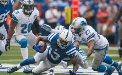 Sep 11, 2016; Indianapolis, IN, USA; Indianapolis Colts wide receiver T.Y. Hilton (13) dives for more yardage while being tackled by Detroit Lions free safety Glover Quin (27) in the first quarter of the game at Lucas Oil Stadium. Mandatory Credit: Trevor Ruszkowski-USA TODAY Sports