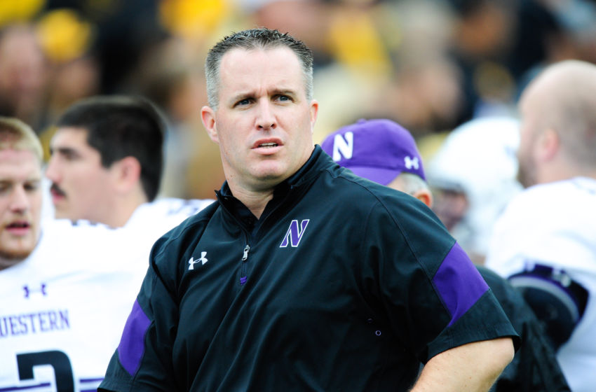 Pat Fitzgerald celebrates with Northwestern after NCAA Tournament win