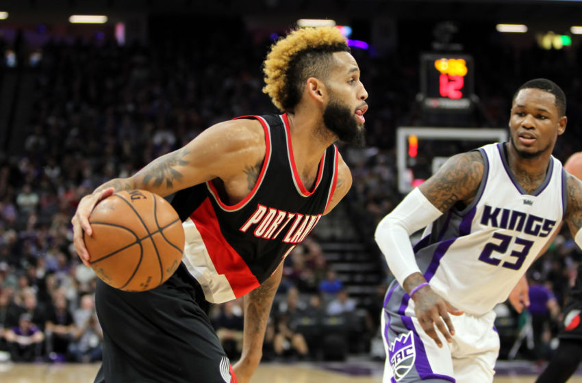 Dec 20, 2016; Sacramento, CA, USA; Portland Trail Blazers guard Allen Crabbe (23) drives to the basket past Sacramento Kings guard <a rel=