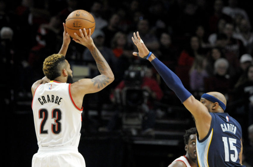 Jan 27, 2017; Portland, OR, USA; Portland Trail Blazers guard Allen Crabbe (23) shoots the ball over Memphis Grizzlies guard Vince Carter (15) during the first quarter of the game at the Moda Center. Mandatory Credit: Steve Dykes-USA TODAY Sports