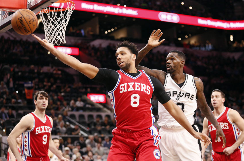 Feb 2, 2017; San Antonio, TX, USA; Philadelphia 76ers center Jahlil Okafor (8) reaches for the ball in front of San Antonio Spurs center <a rel=