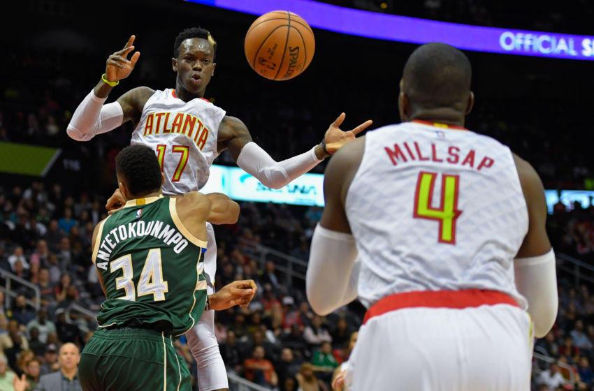 Nov 16, 2016; Atlanta, GA, USA; Atlanta Hawks guard Dennis Schroder (17) passes the ball to forward Paul Millsap (4) over Milwaukee Bucks forward <a rel=