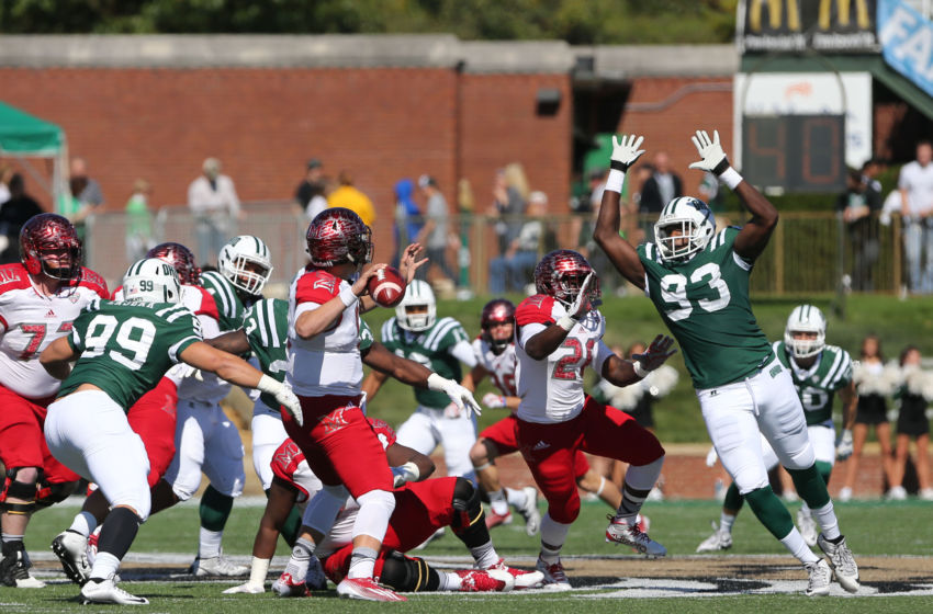 Oct 10, 2015; Athens, OH, USA; Miami (Oh) Redhawks quarterback Billy Bahl (5) looks to pass while under pressure from Ohio Bobcats defensive lineman Tarell Basham (93) in the first half at Peden Stadium. Mandatory Credit: Aaron Doster-USA TODAY Sports