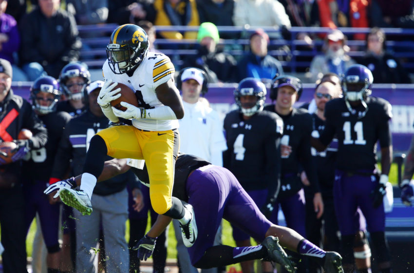 Oct 17, 2015; Evanston, IL, USA; Iowa Hawkeyes defensive back Desmond King (14) intercepts a pass intended for Northwestern Wildcats wide receiver Christian Jones (14) during the first quarter at Ryan Field. Mandatory Credit: Jerry Lai-USA TODAY Sports