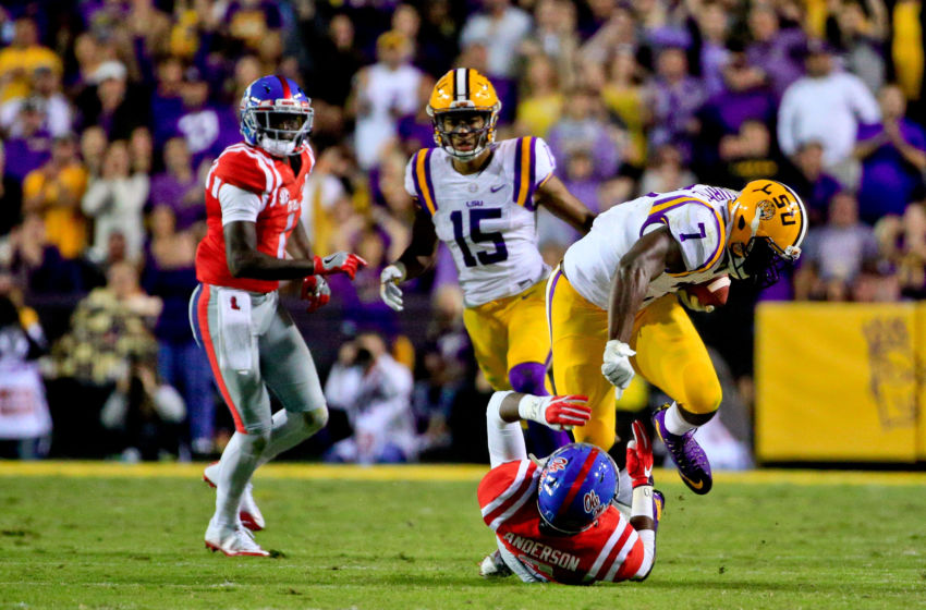 Oct 22, 2016; Baton Rouge, LA, USA; LSU Tigers running back Leonard Fournette (7) runs over Mississippi Rebels defensive back Deontay<a rel=