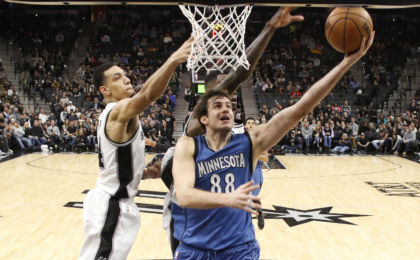 Jan 17, 2017; San Antonio, TX, USA; Minnesota Timberwolves power forward Nemanja Bjelica (88) shoots the ball under pressure from San Antonio Spurs shooting guard <a rel=